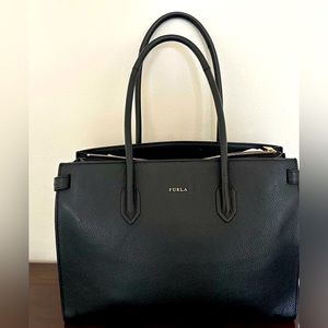 Gently used beautiful Furla tote in black leather with gold hardware.
